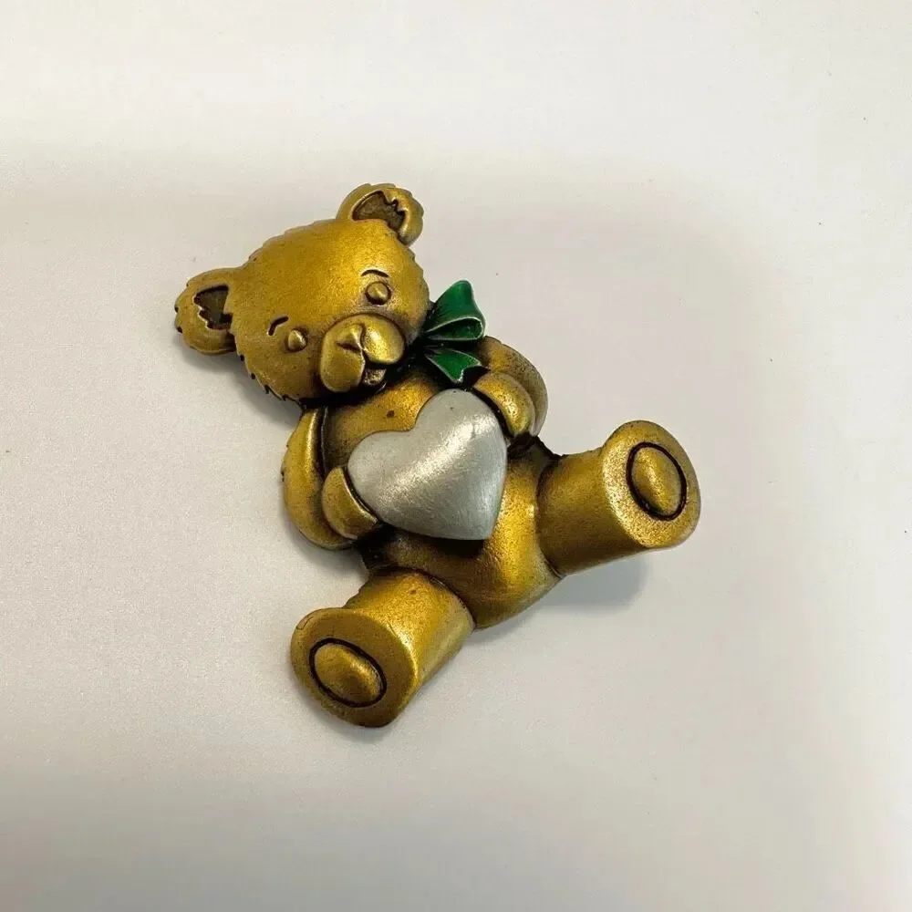 Jeanette Jewelry Gold and  Silver tone Bear holding a heart brooch